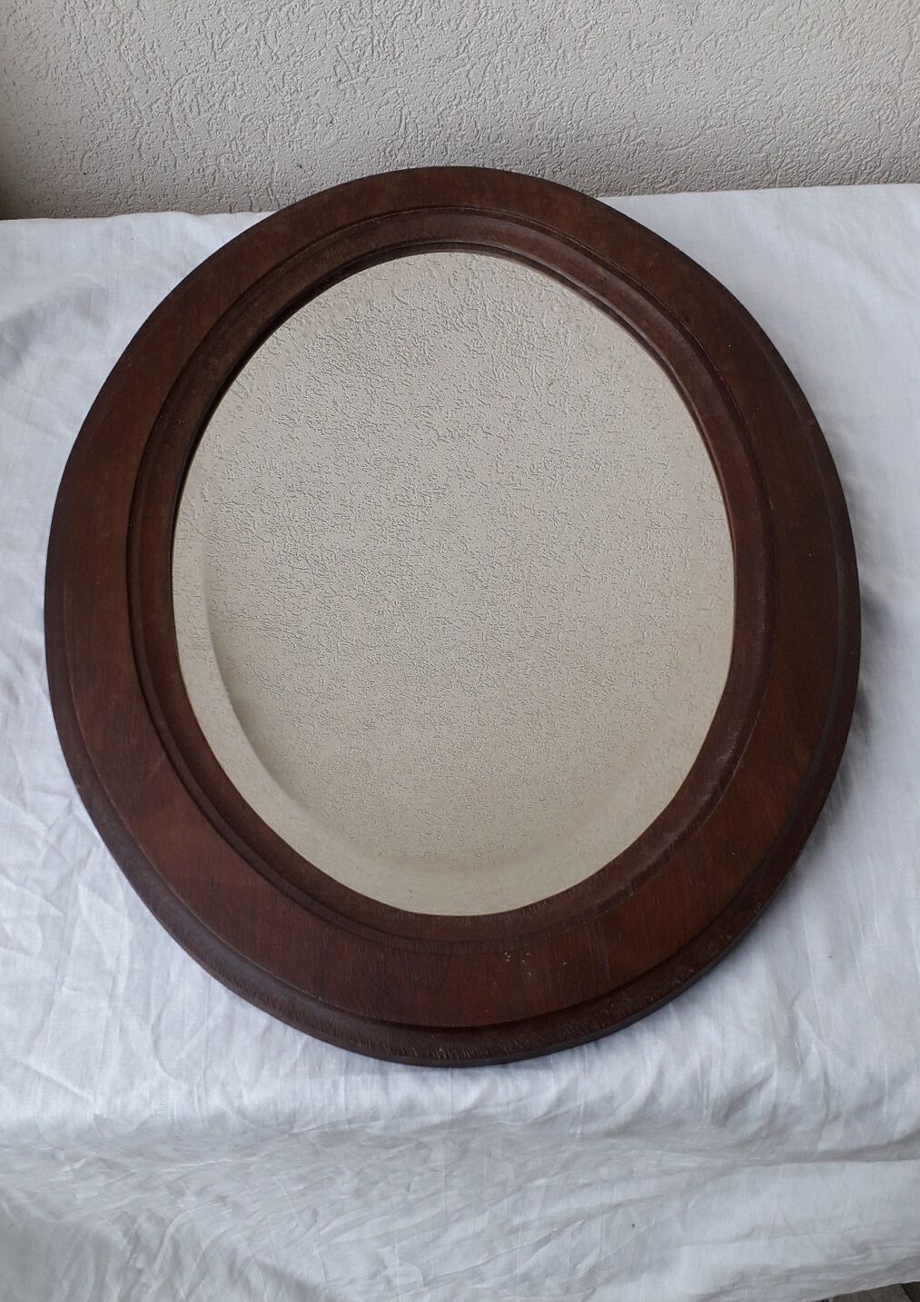 Oval wooden mirror