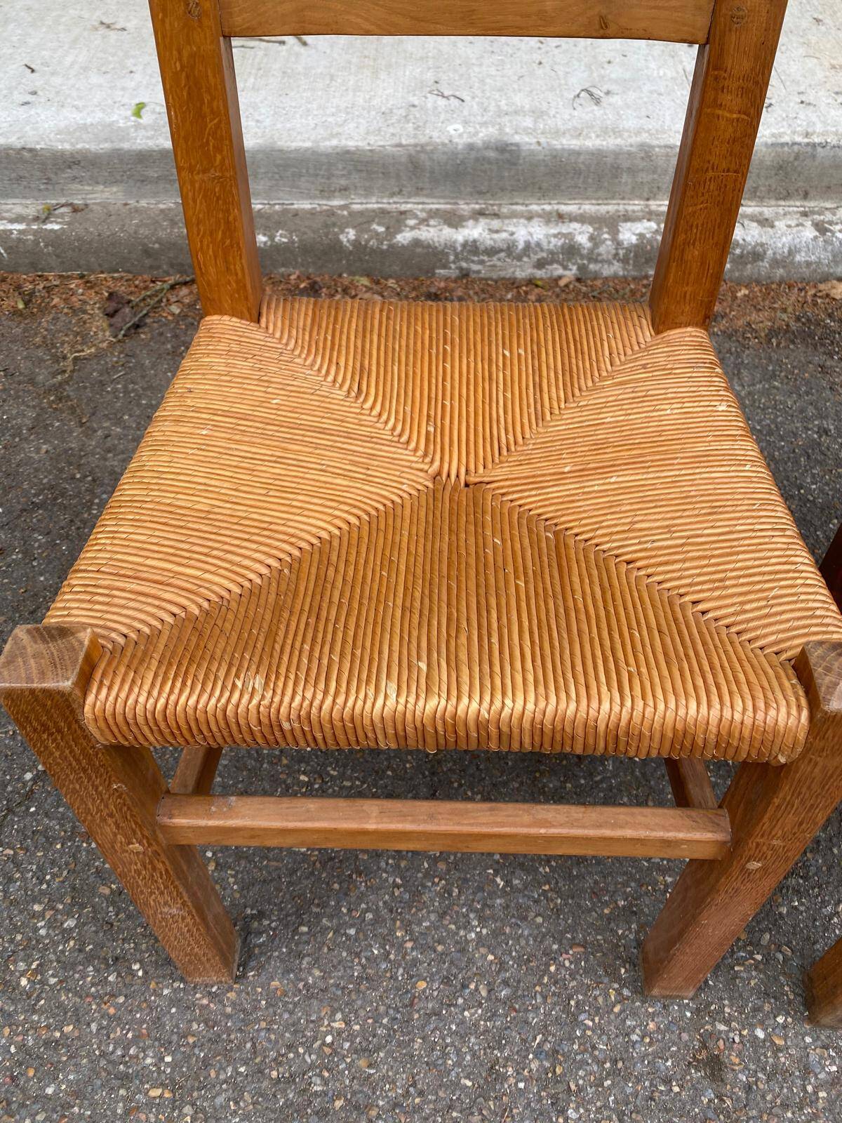 2 solid wood and straw chairs