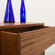 Oiled walnut TV stand equipped with 2 sliding doors and 3 drawers