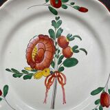 Easternth century earthenware plate, ribboned floral decoration