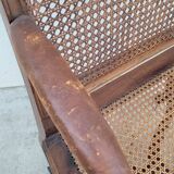 Louis XV Regency cane armchair leather armrests decorated with shell