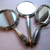 Art Nouveau hand-facing, mirror in repulsed silver frame, rose decoration 14x27cm