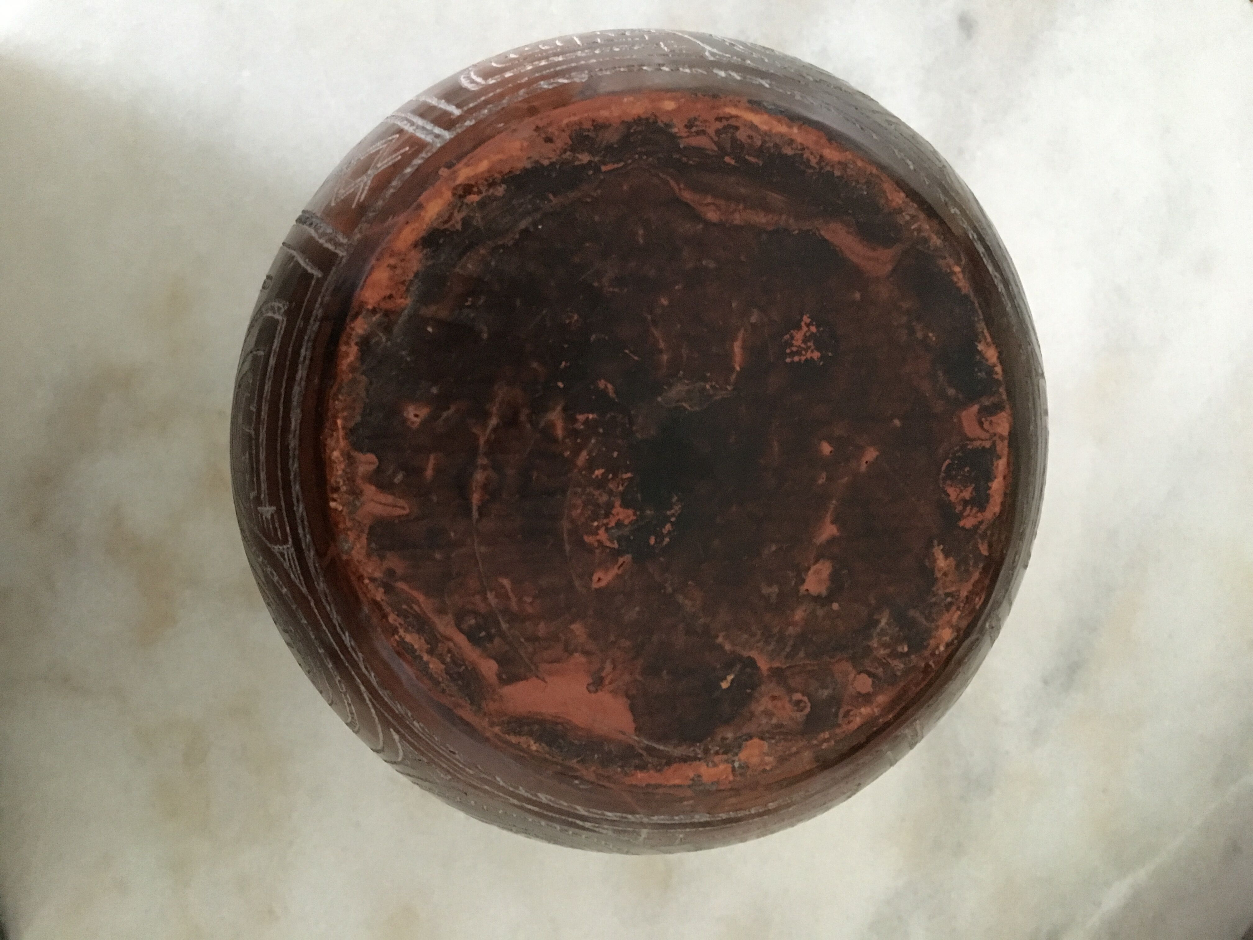 Vase in earth baked ethnic graphic patterns