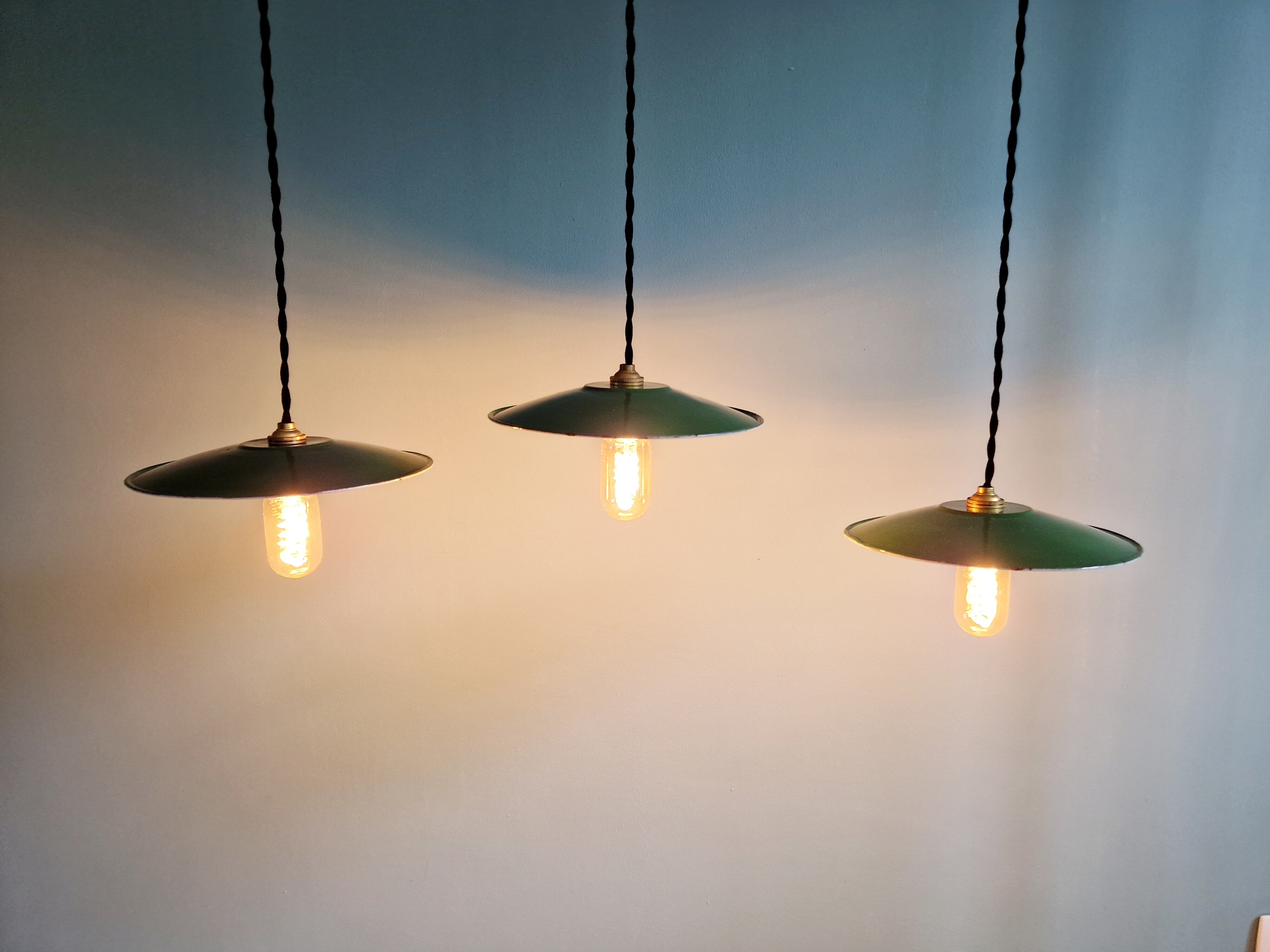 Trio of large industrial suspensions in green enamelled sheet metal.