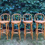 Set of four cane and webbing bar stools