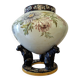 Large polychrome ceramic cache-pot with floral decoration.