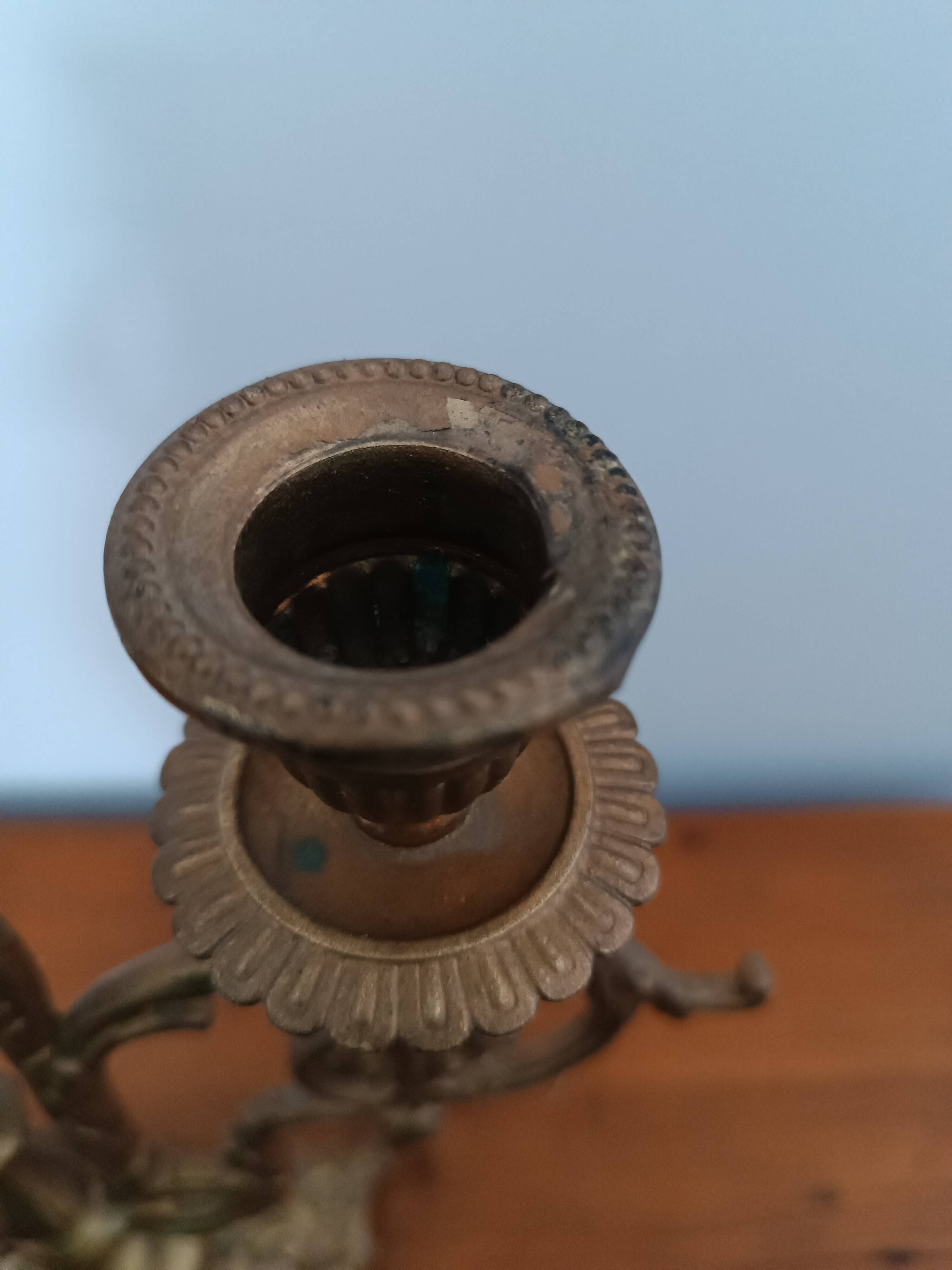 Bronze candlestick with lion head decoration