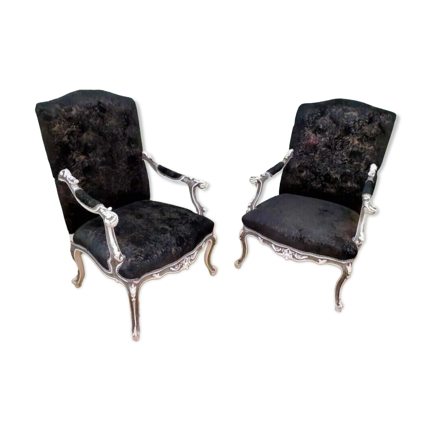 Black Louis XV style armchairs