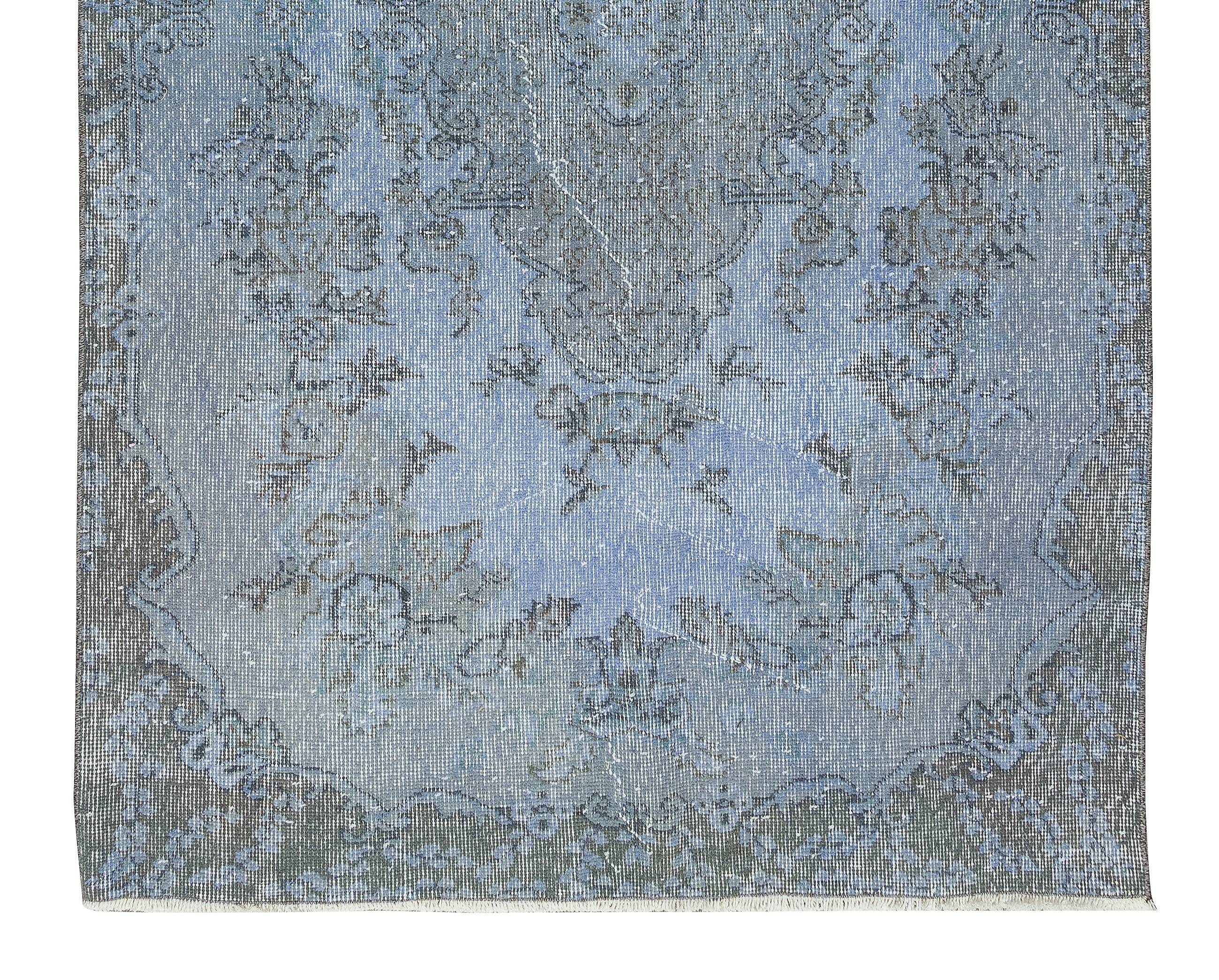 Hand-knotted turkish rug over-dyed in light blue