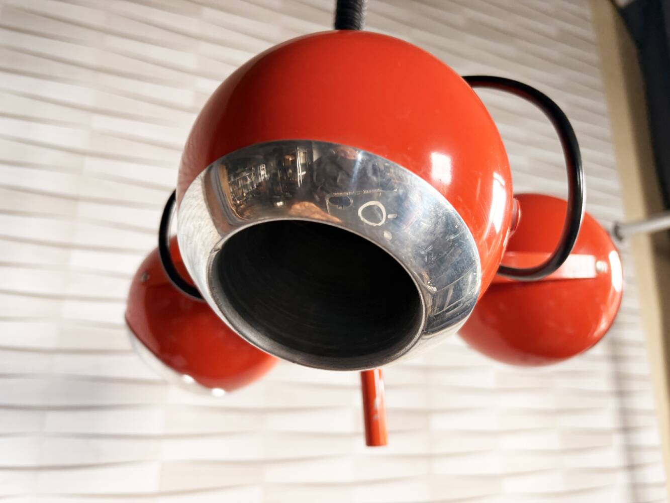 Suspended eyeballs, space age, bright orange, vintage, 70s
