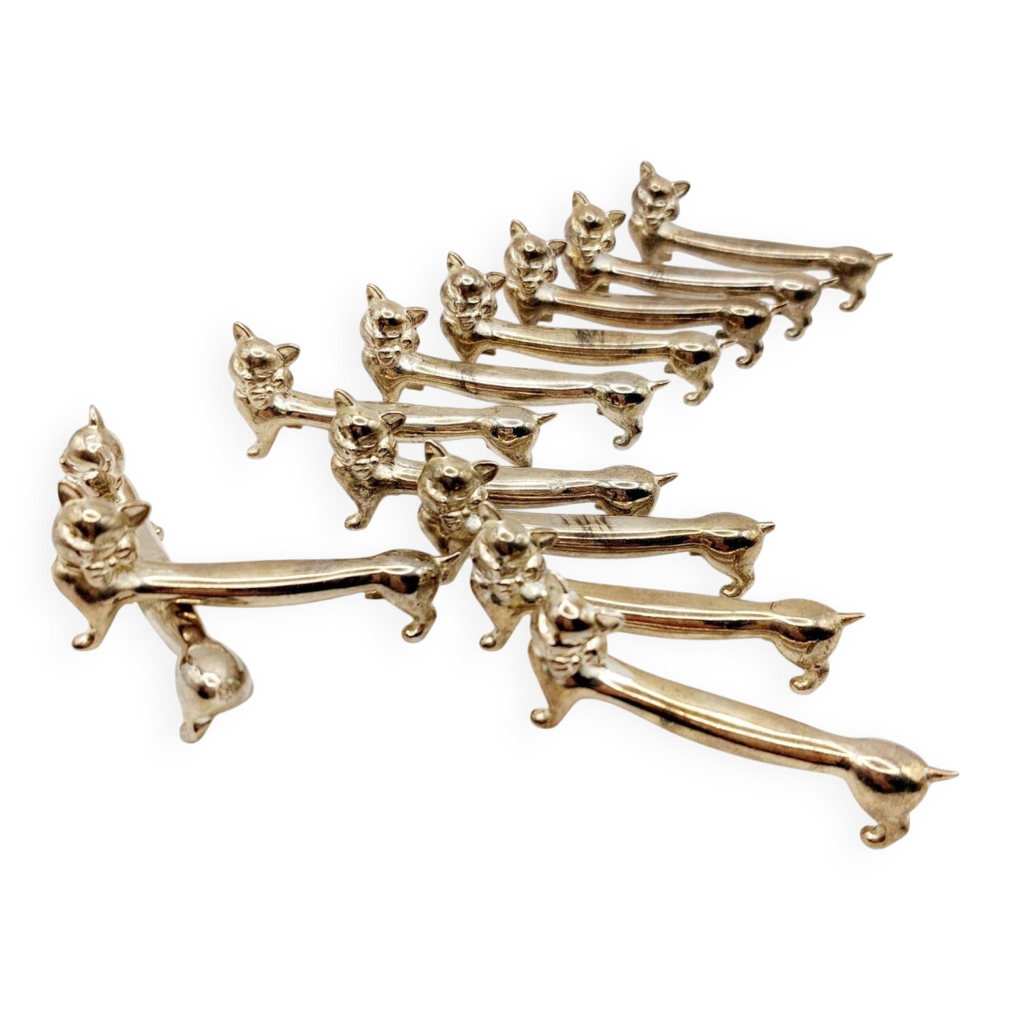 12 vintage silver metal cat knot knife rests