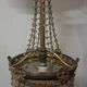 Antique balloon chandelier with pendants, in brass and with mouldings.