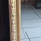 Antique mirror in wood and gilded stucco, neo Louis XVI style.