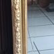 Antique mirror in wood and gilded stucco, neo Louis XVI style.
