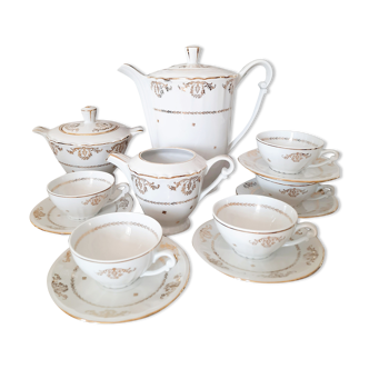 Coffee set in white porcelain and gilded designs