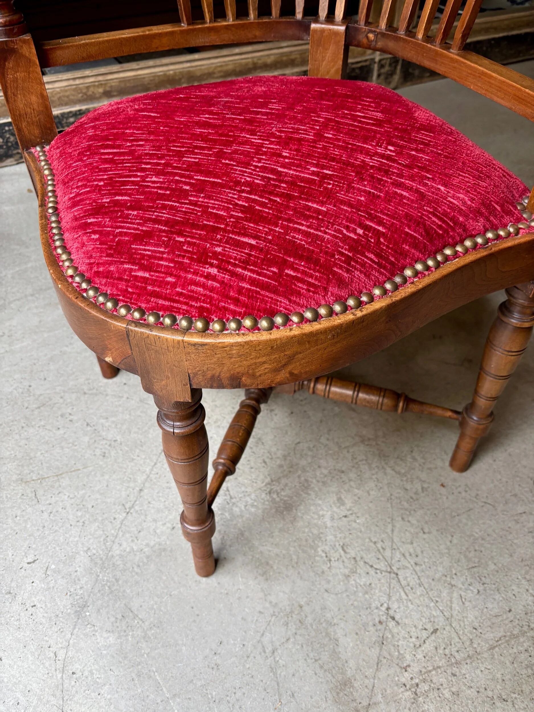Corner armchair, dark wood and red velvet office chair.