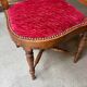 Corner armchair, dark wood and red velvet office chair.