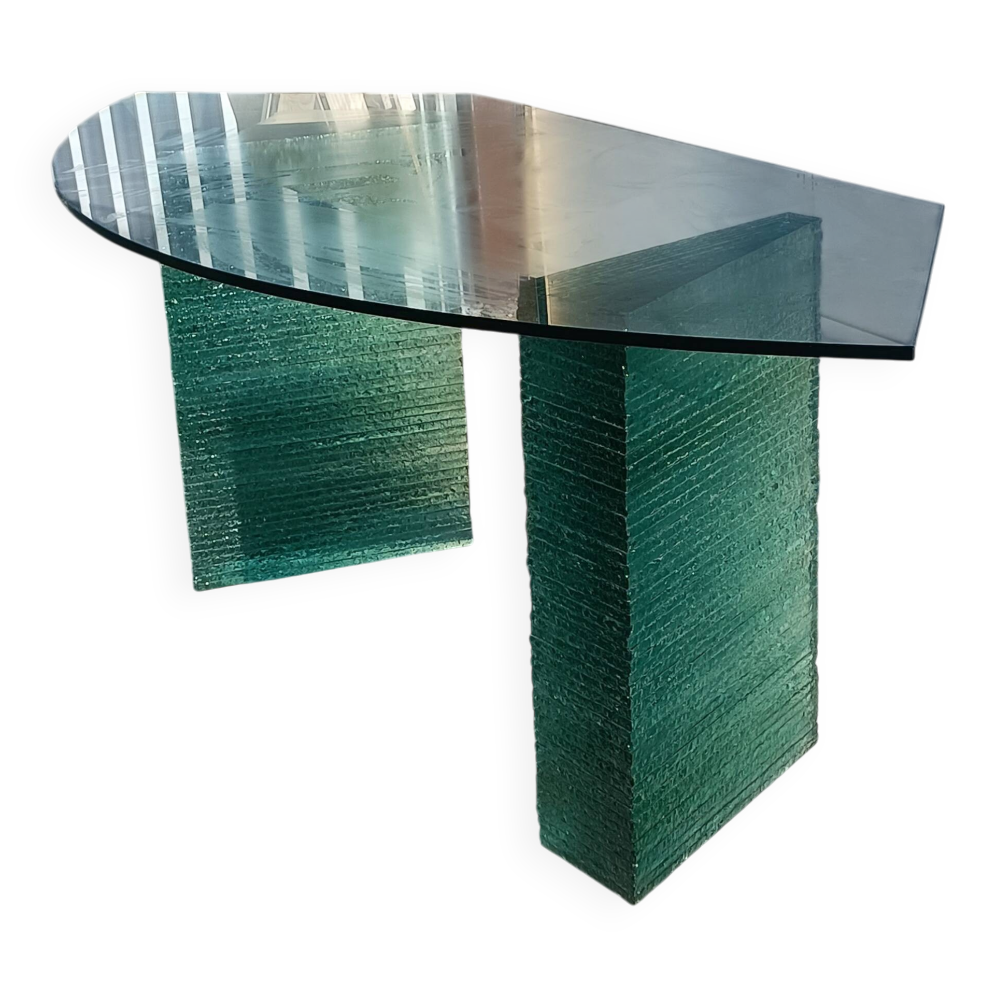 Solid glass desk with a half-moon top.