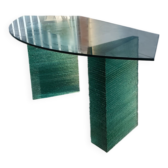 Solid glass desk with a half-moon top.