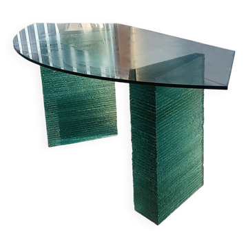 Solid glass desk with a half-moon top.