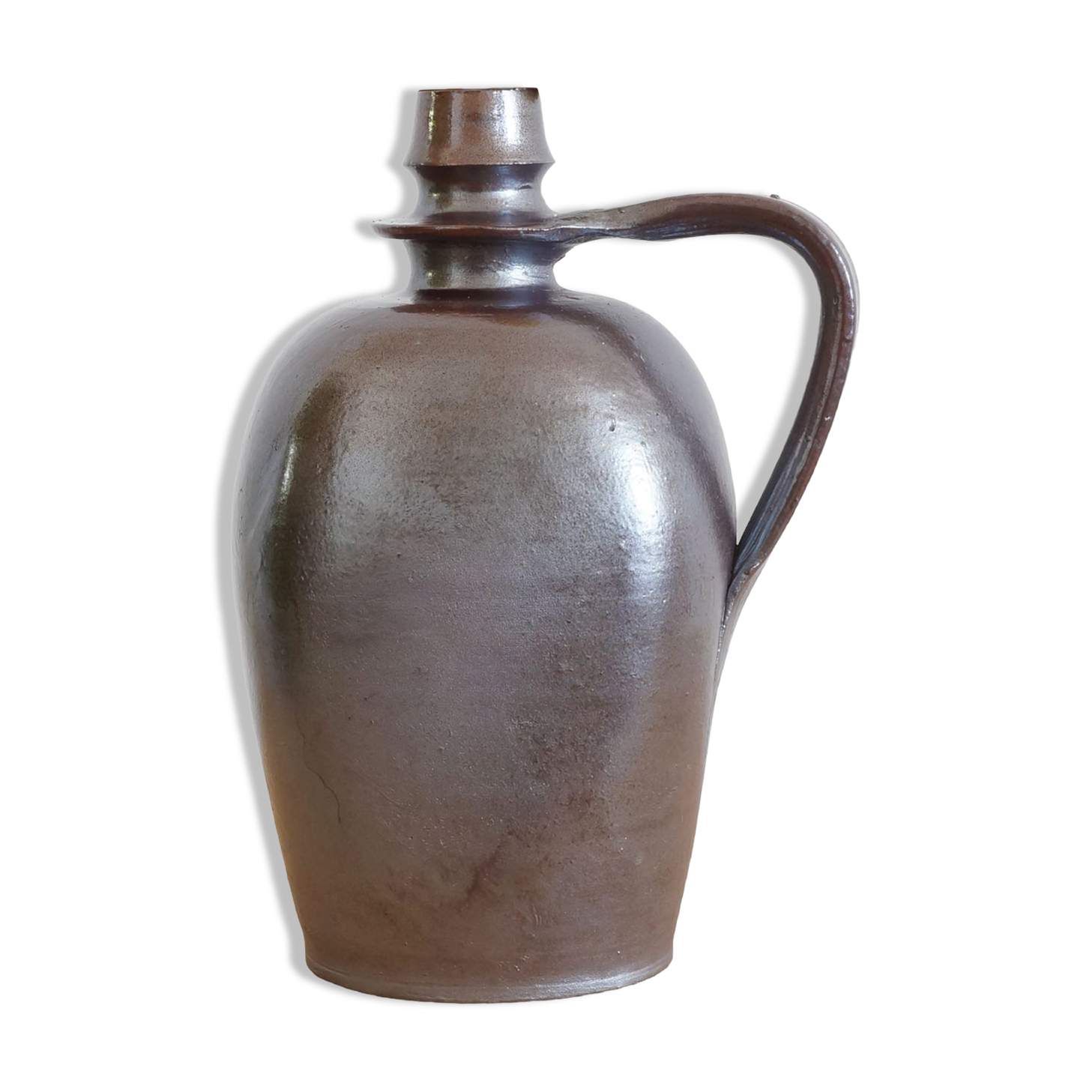 Old Norman bottle in brown ceramic