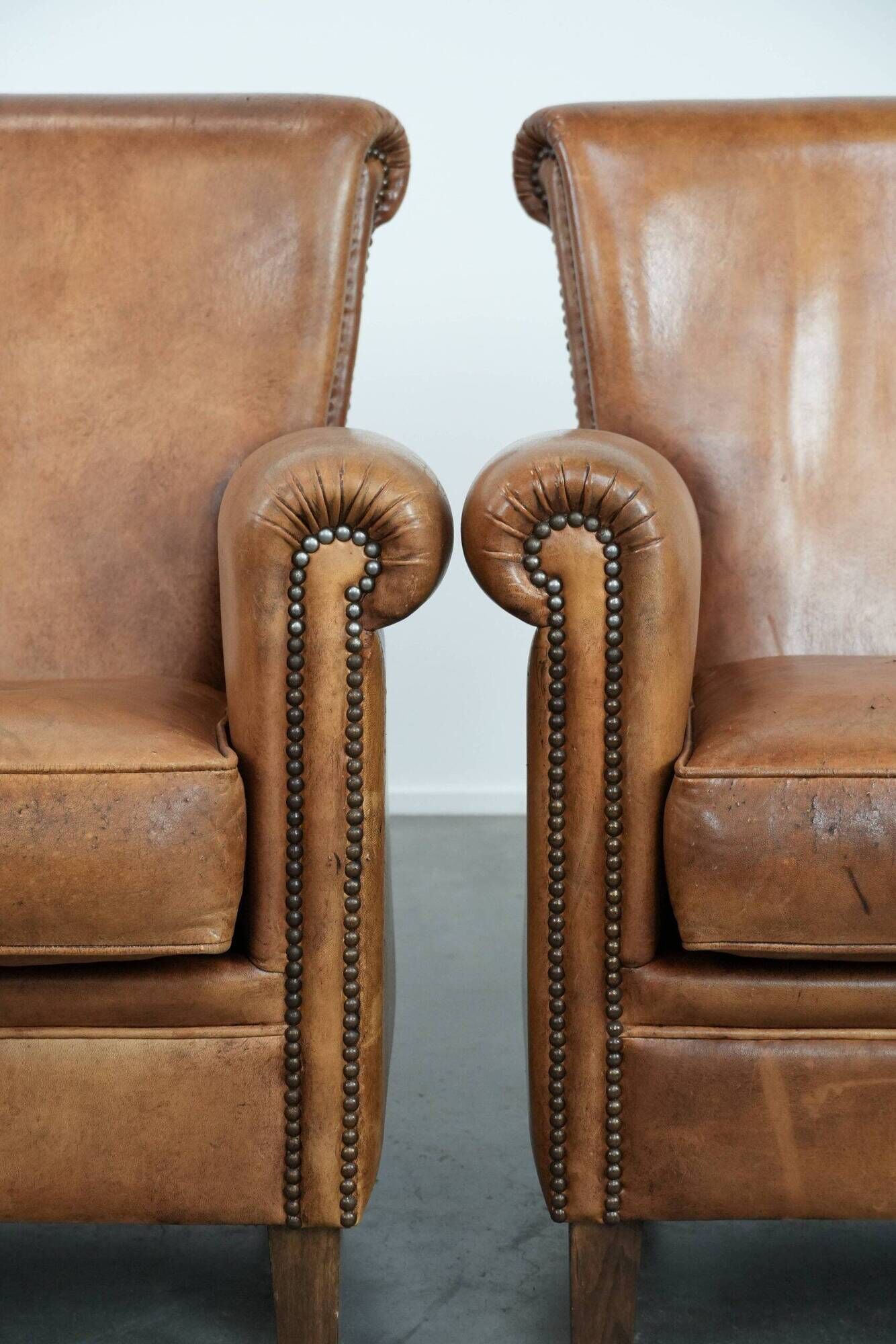Set of two vintage sheepskin armchairs with beautiful and warm colours