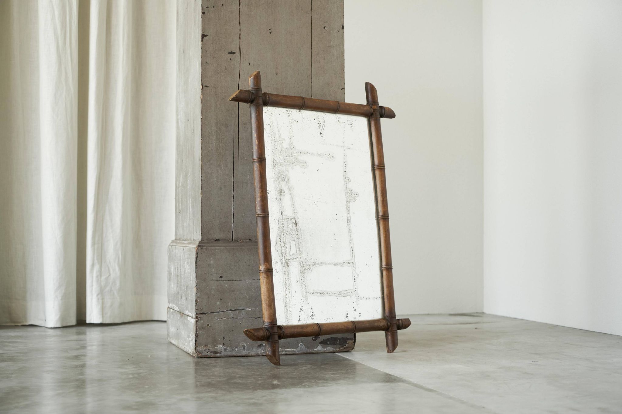 Large faux bamboo mirror in solid wood and patinated mirror, early 20th century.