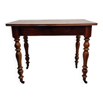 Antique wooden desk with a drawer.