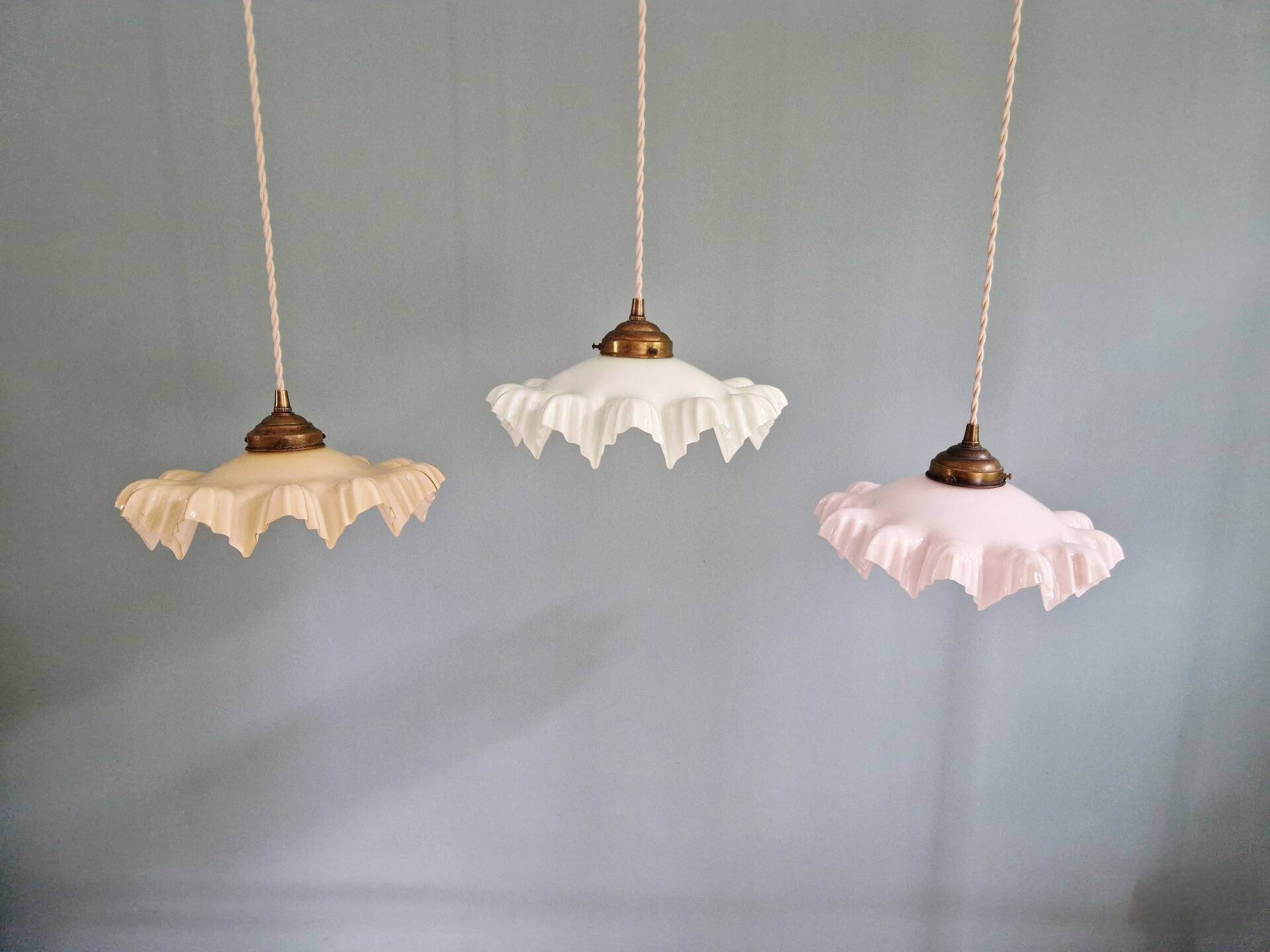 Art Deco trio of suspensions in coloured frilled opaline, 1920-30.