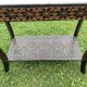 Carved wooden quadrupedal pedestal table