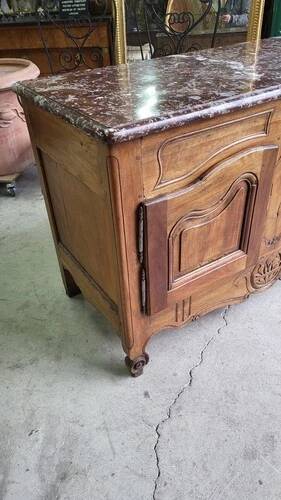 Very Louis XV from the 18th century in walnut with a marble top.
