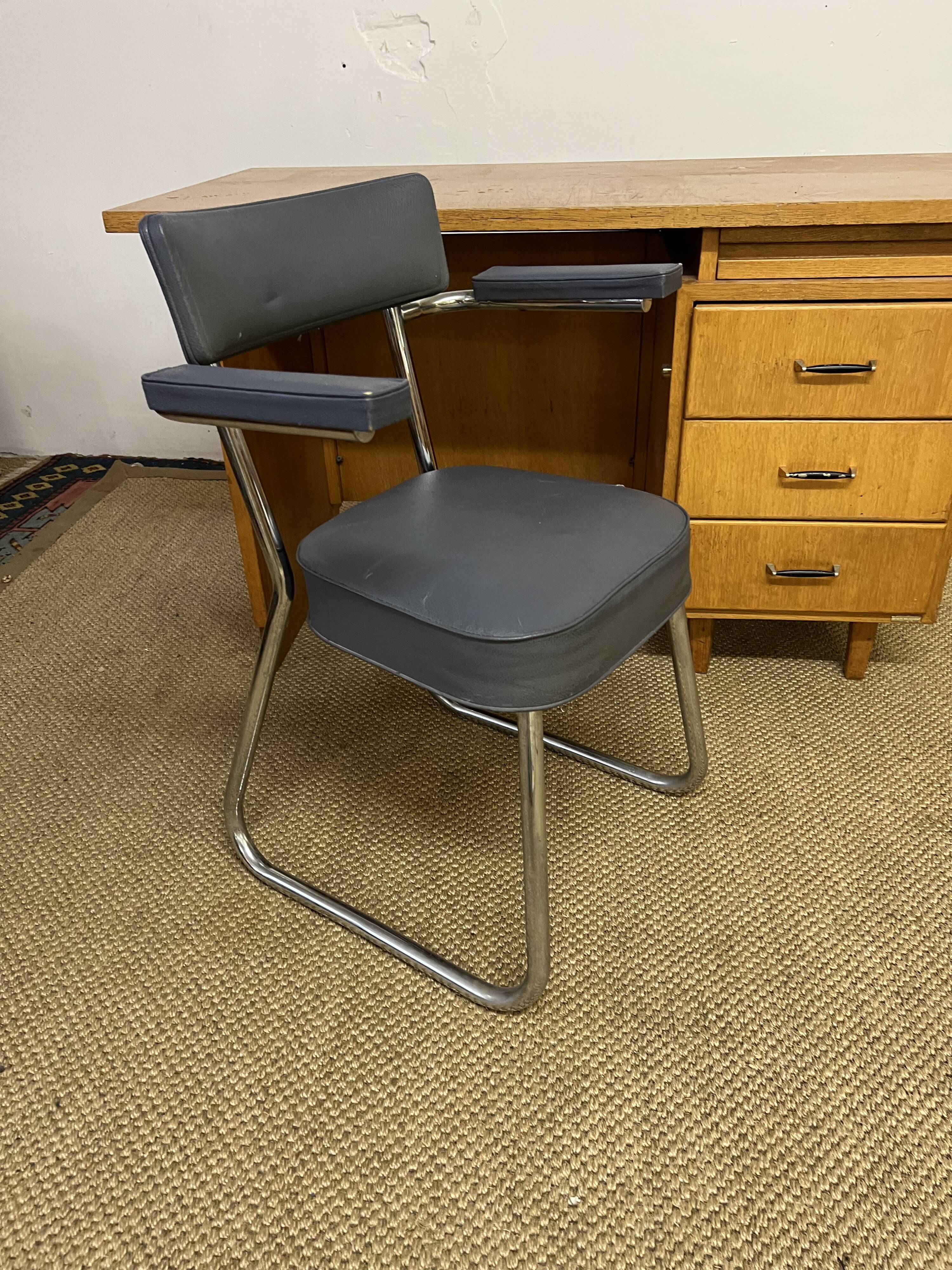 Old wooden desk and armchair