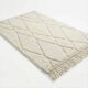 Berber wool rug with abstract white patterns