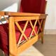 Pair of vintage wooden armchairs with braces