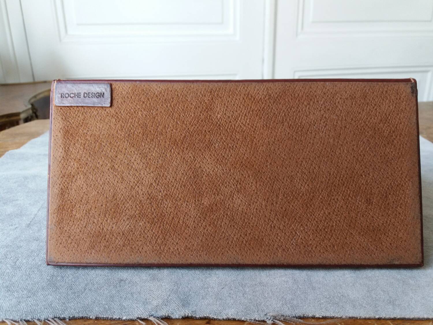 Letter holder covered in leather and golden metal by roche design
