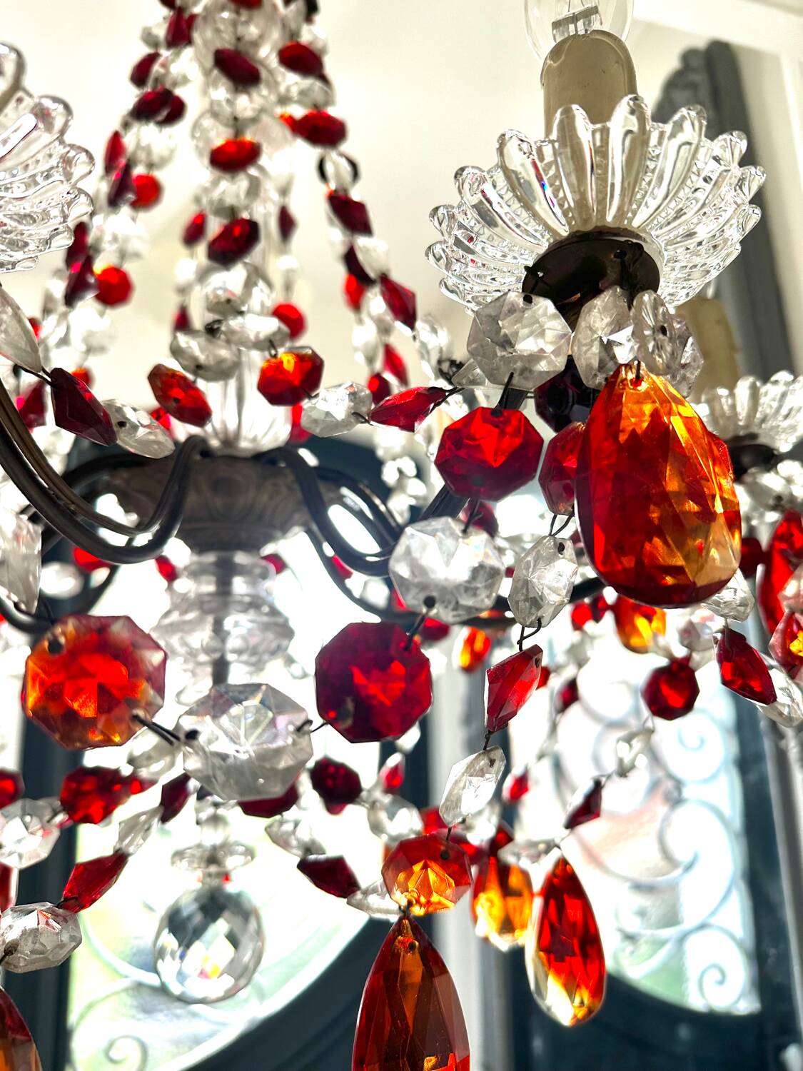 Antique chandelier with red crystal pendants, 9 lights.