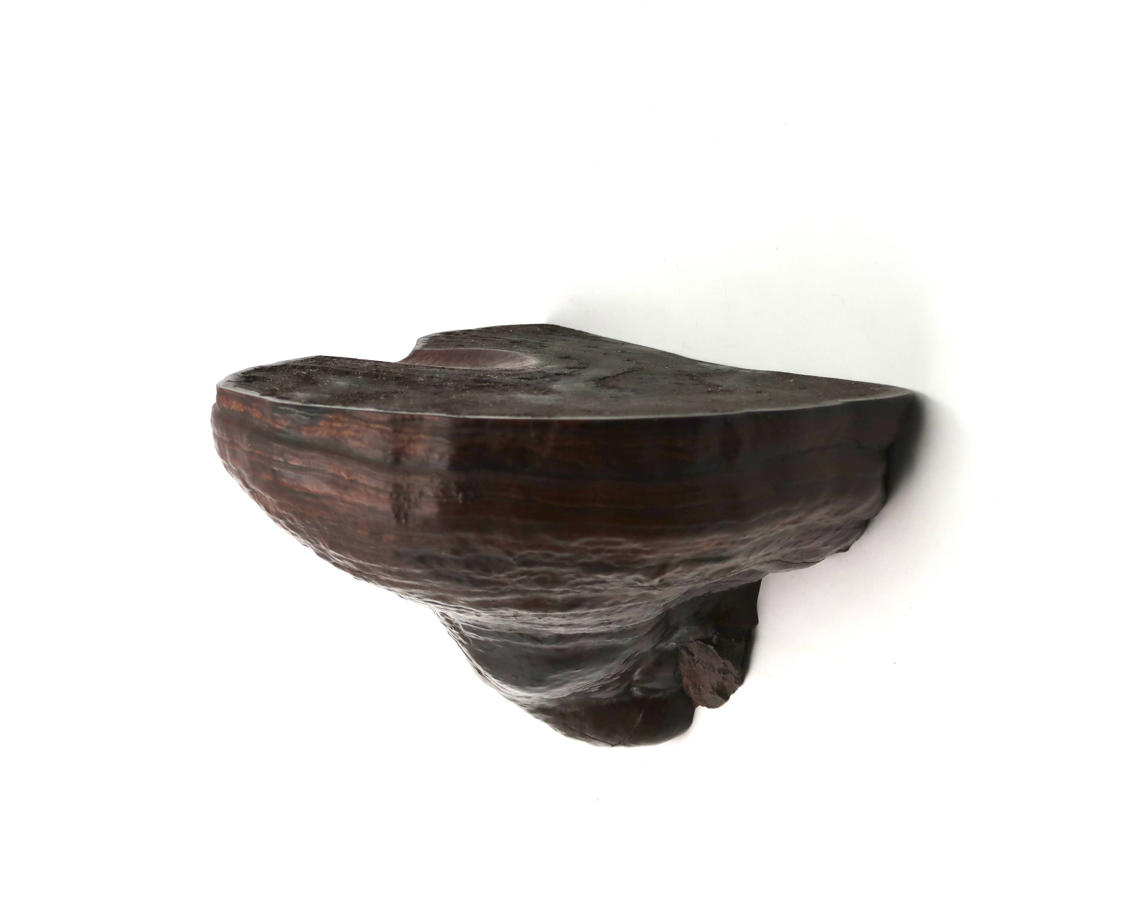 Natural mushroom-shaped wall shelf in dark wood, 1970s.