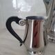Rémy Letang / Teapot, milk jug and sugar bowl in 18/10 stainless steel and Bakelite