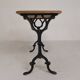 Bistro table with an oak top on a cast iron base, 1930s.