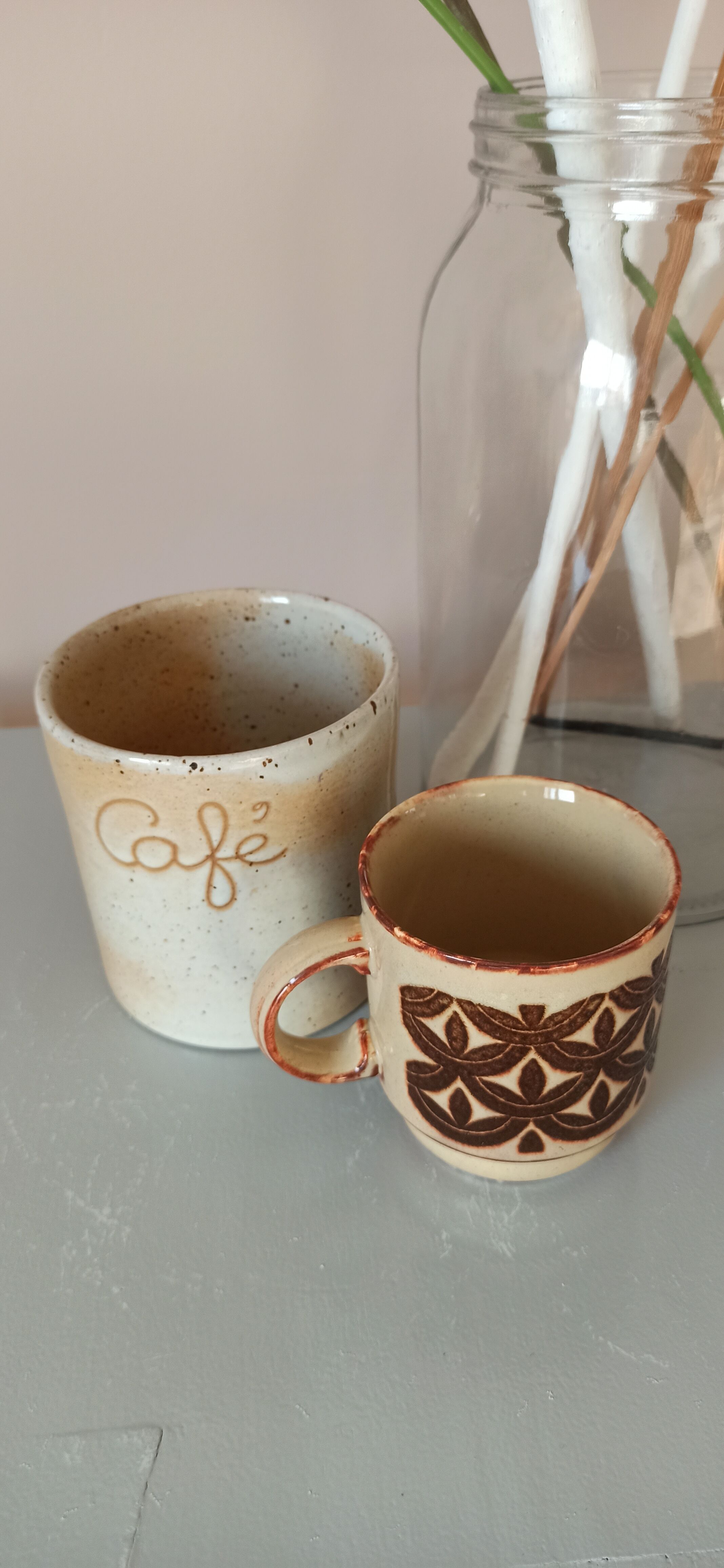 Coffee pot and mug cup in sandstone