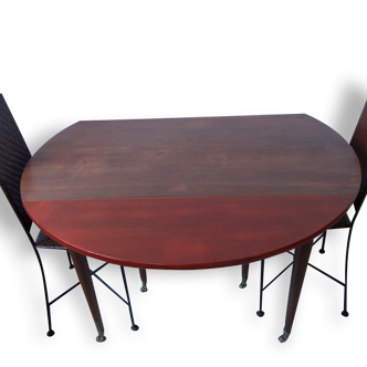 Round wooden table and two chairs