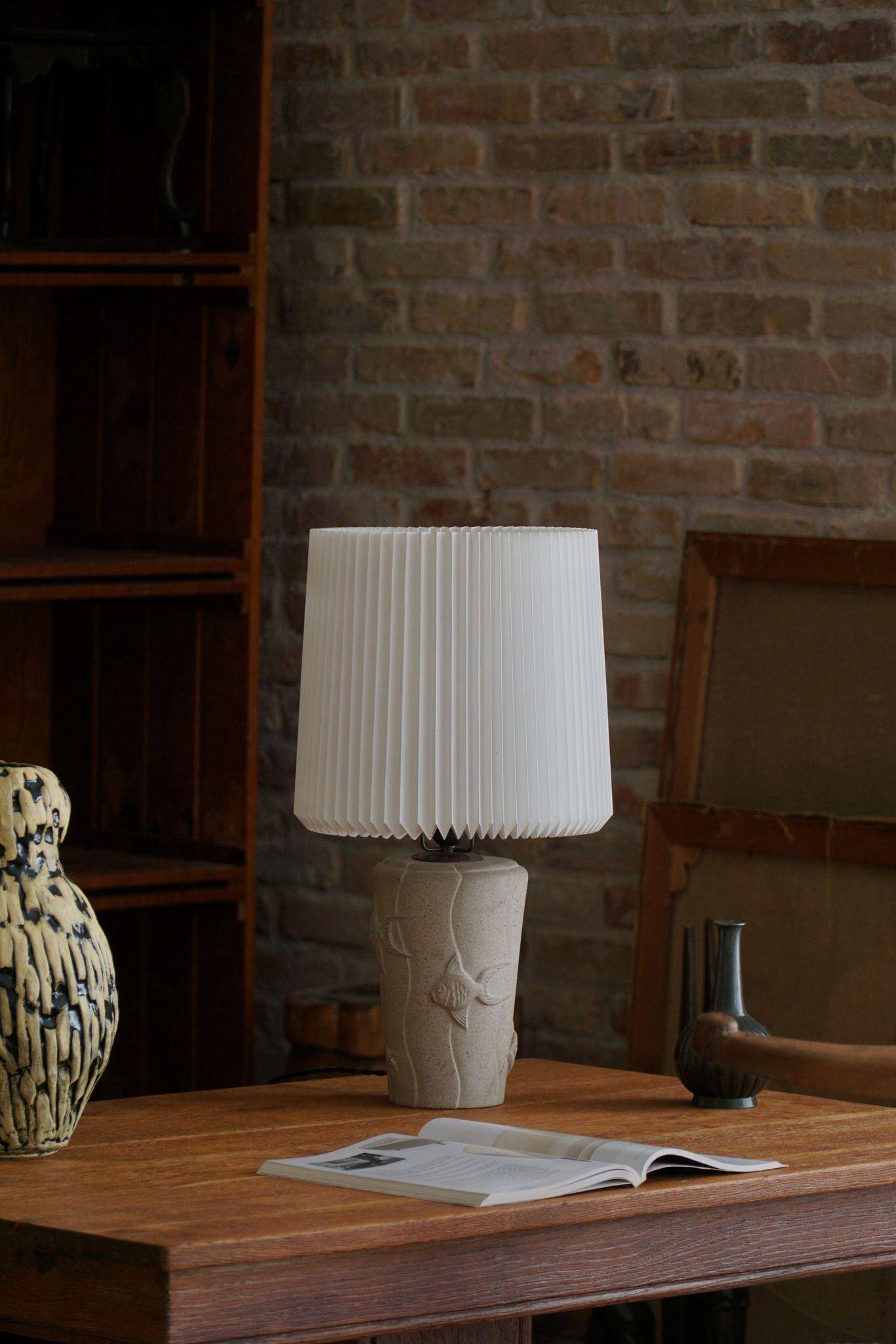 Modern vintage French table lamp, made of stone with fish patterns, 1970s.