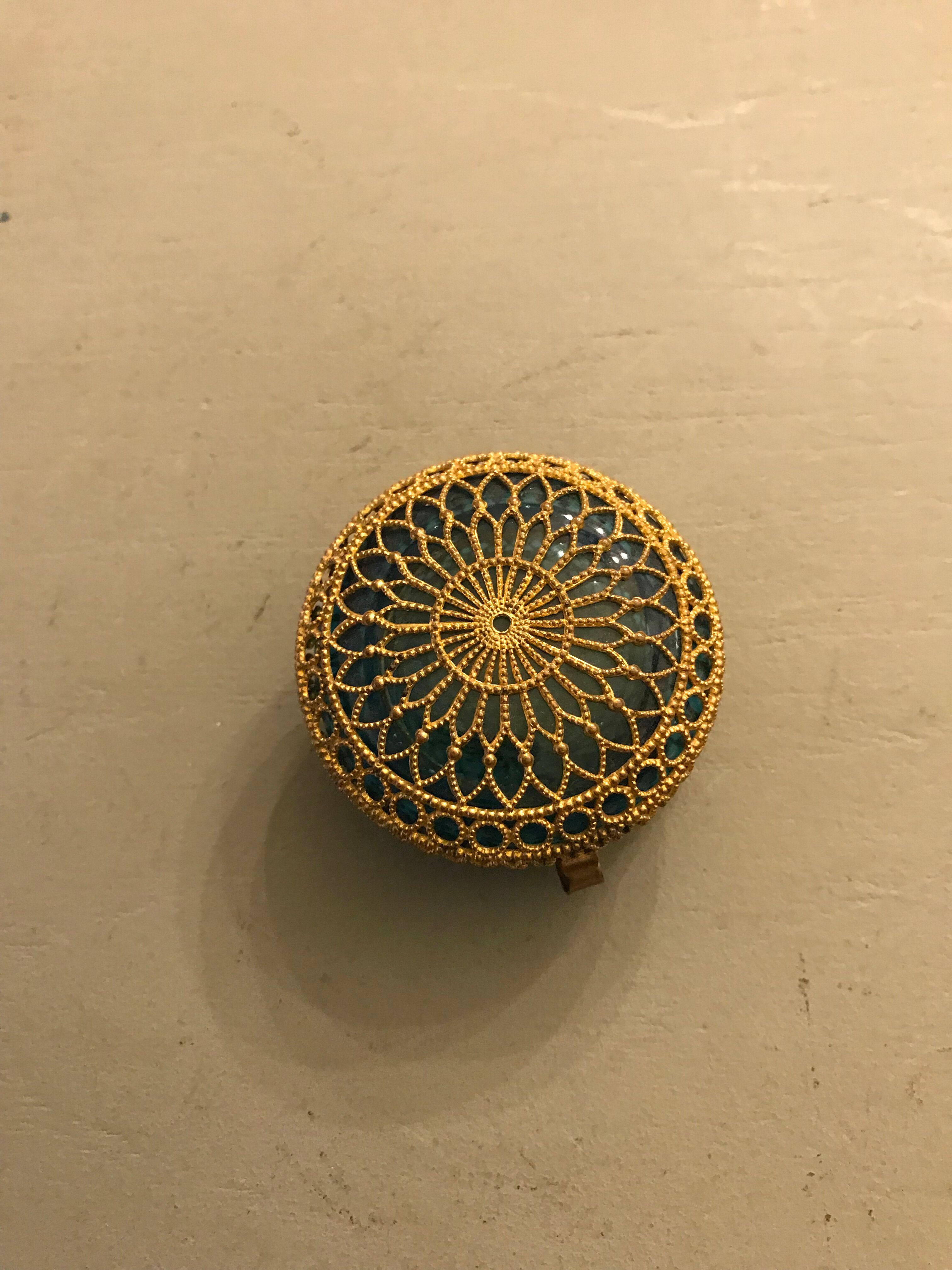 Old pill box made of golden thread