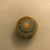 Old pill box made of golden thread