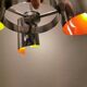Hanging lamp in chromed metal with orange contrast lacquer and three light sources.