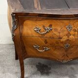 Curved and inlaid Louis XV style chest of drawers