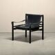 Fauteuil de salon Sirocco Safari Arne Norell en cuir noir et frêne teinté.