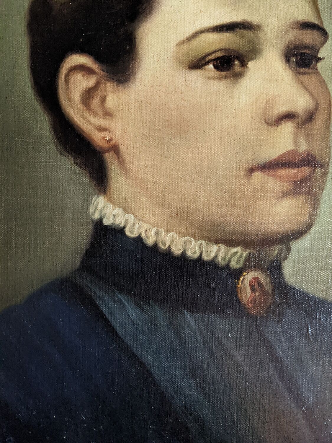 Oil on canvas portrait in an antique gilded wooden frame.