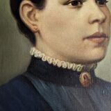 Oil on canvas portrait in an antique gilded wooden frame.