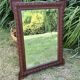 Antique carved wooden mirror